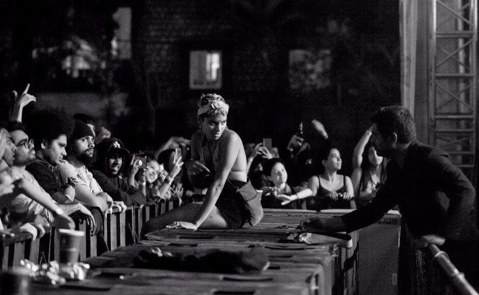 A fan attempts to cross the barrier towards the stage during Anderson Paak's set. Photo © Hari Adivarekar A fan attempts to cross the barrier towards the stage during Anderson Paak's set. Photo © Hari Adivarekar
