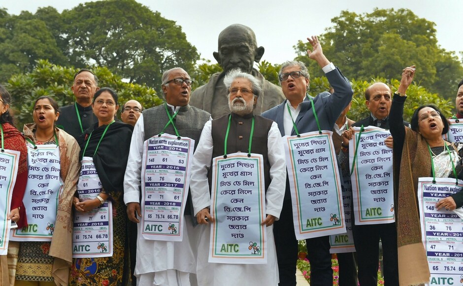 TMC members held protest against price hike in diesel and petrol in the Budget Session outside the Parliament on Tuesday. The Rajya Sabha was adjourned twice till late afternoon due to protests by Opposition members including those from the Congress and the TMC, who alleged that their voice was being