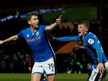 Rochdale's Steven Davies celebrates scoring their second goal with Andy Cannon. Reuters