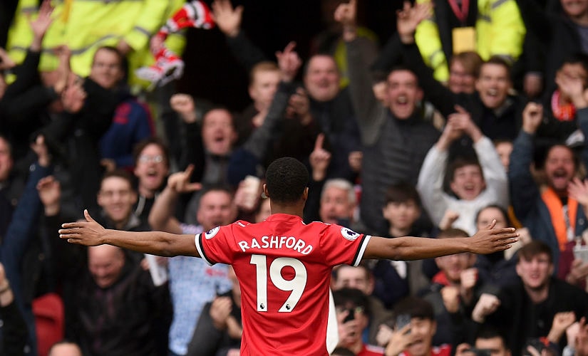 Manchester United's English midfielder Ashley Young celebrates scoring their second goal during the English Premier League football match between Manchester United and Liverpool at Old Trafford in Manchester, north west England, on March 10, 2018. / AFP PHOTO / Oli SCARFF / RESTRICTED TO EDITORIAL USE. No use with unauthorized audio, video, data, fixture lists, club/league logos or 'live' services. Online in-match use limited to 75 images, no video emulation. No use in betting, games or single club/league/player publications. /