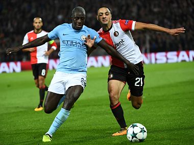 Manchester City's French defender Benjamin Mendy (L) vies for the ball with Feyenoord's Moroccan midfielder Sofyan Amrabat during the UEFA Champions League Group F football match between Feyenoord Rotterdam and Manchester City at the Feyenoord Stadium in Rotterdam, on September 13, 2017. / AFP PHOTO / Emmanuel DUNAND