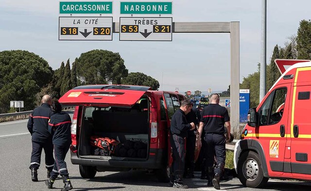 After driving around 15 minutes to a Super U supermarket in the sleepy town of Trebes, shouting "Allahu Akbar" (God is greatest), a witness reported. He killed another two people and took hostages for more than three hours, armed with a knife and a gun, according to survivors. Another witness said he had grenades. French police and firefighters secure the entrance of Trebes, southern France. AP After driving around 15 minutes to a Super U supermarket in the sleepy town of Trebes, shouting "Allahu Akbar" (God is greatest), a witness reported. He killed another two people and took hostages for more than three hours, armed with a knife and a gun, according to survivors. Another witness said he had grenades. French police and firefighters secure the entrance of Trebes, southern France. AP