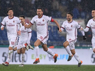 AC Milan's Leonardo Bonucci and team mates celebrate after winning the penalty shootout. Reuters