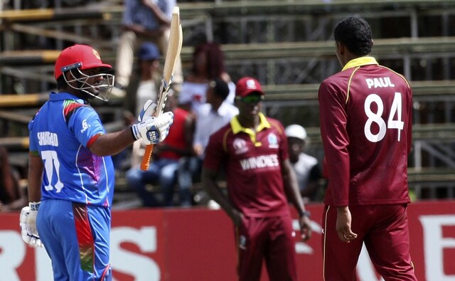 Afghanistan batsman Mohammad Shahzad celebrates after scoring 50 runs during their cricket world cup qualifier match against West Indies at Harare. AP Afghanistan batsman Mohammad Shahzad celebrates after scoring 50 runs during their cricket world cup qualifier match against West Indies at Harare. AP