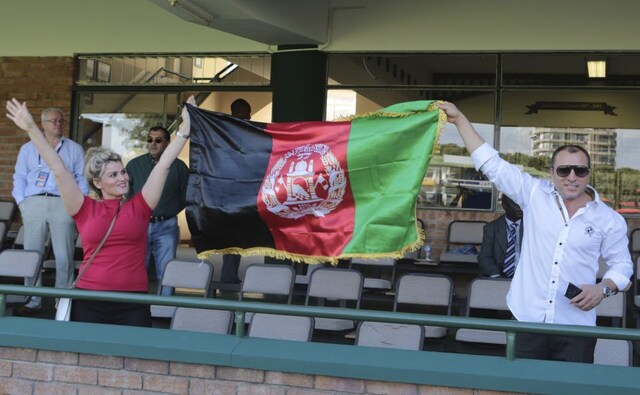 Afghanistan fans hold their flag ahead of the ICC World Cup Qualifiers 2018 final against West Indies. AP Afghanistan fans hold their flag ahead of the ICC World Cup Qualifiers 2018 final against West Indies. AP