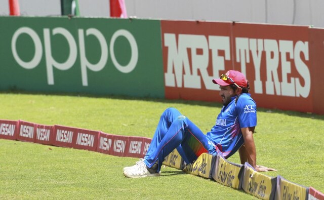 Afghanistan player Gulbadin Naib sits on the boundary during the cricket world cup qualifier match against West Indies at Harare. AP Afghanistan player Gulbadin Naib sits on the boundary during the cricket world cup qualifier match against West Indies at Harare. AP