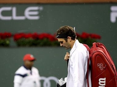 Roger Federer walks off the court after rain halted play at the Indian Wells Masters. Image courtesy: Twitter @BNPPARIBASOPEN