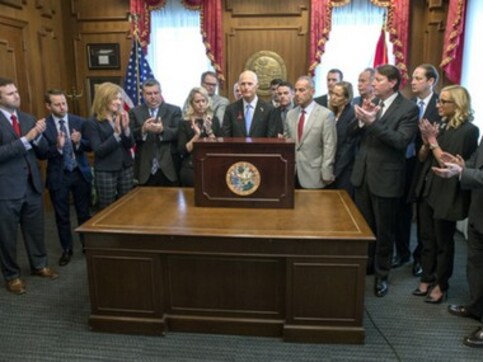 Florida governor Rick Scott signs gun restrictions three weeks after Parkland high school attack; NRA files lawsuit to block law Florida governor Rick Scott signs gun restrictions three weeks after Parkland high school attack; NRA files lawsuit to block law