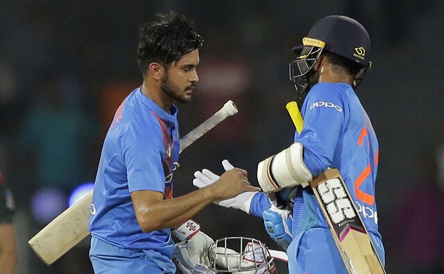Manish Pandey and Dinesh Karthik celebrate after guiding India to a six-wicket win. AP Manish Pandey and Dinesh Karthik celebrate after guiding India to a six-wicket win. AP