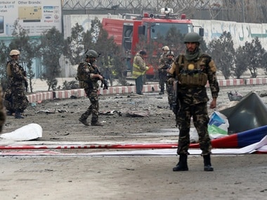 Afghan security forces inspect the site of a suicide bomb attack in Kabul, Afghanistan. Reuters