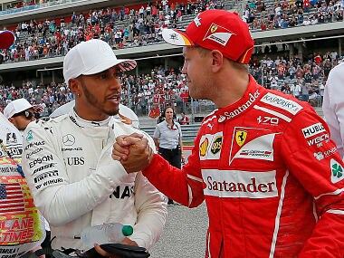 Mercedes driver Lewis Hamilton with Ferrari driver Sebastian Vettel. AP