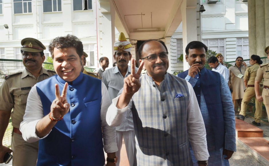 Uttar Pradesh Energy Minister Shrikant Sharma and Health Minister Sidharth Nath Singh flash victory signs after voting. The Opposition parties later moved the poll panel against two MLAs who are believed to have cross-voted. The Samajwadi Party also lodged a similar complaint with regard to MLA Nitin Agarwal, who had switched sides after his father quit the party and joined the BJP recently. PTI Uttar Pradesh Energy Minister Shrikant Sharma and Health Minister Sidharth Nath Singh flash victory signs after voting. The Opposition parties later moved the poll panel against two MLAs who are believed to have cross-voted. The Samajwadi Party also lodged a similar complaint with regard to MLA Nitin Agarwal, who had switched sides after his father quit the party and joined the BJP recently. PTI