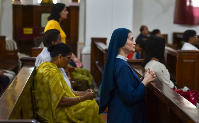 Good Friday rituals and traditions vary across churches around the globe. The ceremony is somber as candles remain unlit in churches and the altars wear a bare look. Devotees praying at a church in Kolkata. PTI Good Friday rituals and traditions vary across churches around the globe. The ceremony is somber as candles remain unlit in churches and the altars wear a bare look. Devotees praying at a church in Kolkata. PTI