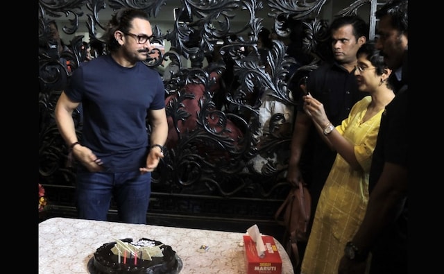 Aamir Khan poses for a photograph while Kiran Rao dons the photographer's mantle. Firstpost image/Sachin Gokhale Aamir Khan poses for a photograph while Kiran Rao dons the photographer's mantle. Firstpost image/Sachin Gokhale