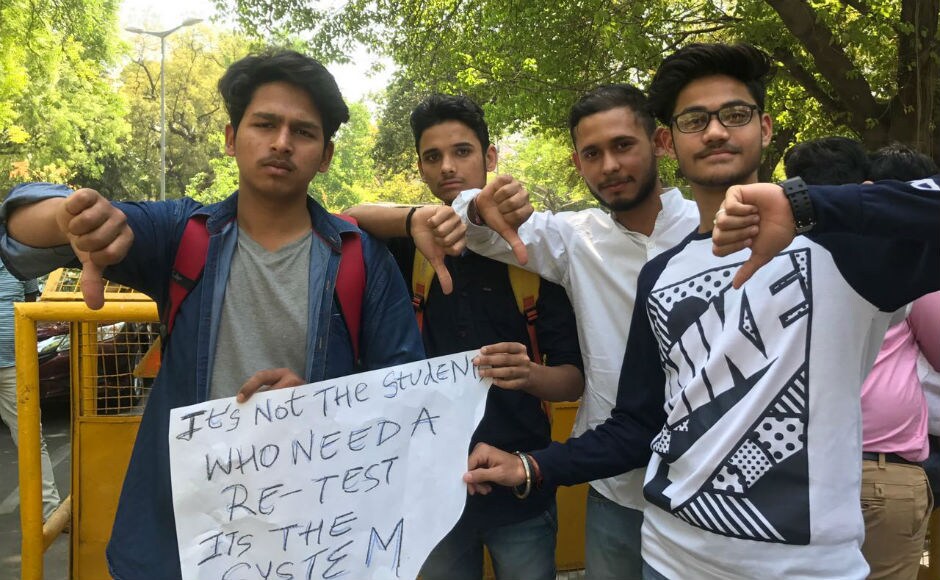 Holding placards, with slogans like 'Stop playing hit and trial with our lives' and 'It's not the students who need a retest, it's the system', the students rued how they have been left "traumatised" after hearing the news of re-examination. Firstpost/Pallavi Rebbapragada Holding placards, with slogans like 'Stop playing hit and trial with our lives' and 'It's not the students who need a retest, it's the system', the students rued how they have been left "traumatised" after hearing the news of re-examination. Firstpost/Pallavi Rebbapragada