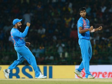 India's Washington Sundar (right) celebrates with captain Rohit Sharma after dismissing Kusal Mendis. AFP 