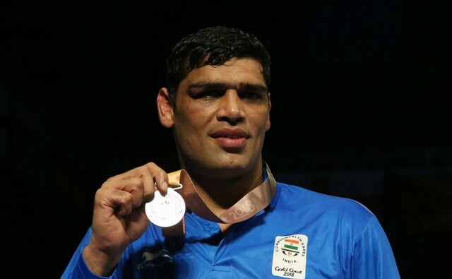 India's Satish Kumar shows his silver medal during the medal ceremony for the men's +91 kg boxing at the Oxenford Studios during the 2018 Commonwealth Games. PTI India's Satish Kumar shows his silver medal during the medal ceremony for the men's +91 kg boxing at the Oxenford Studios during the 2018 Commonwealth Games. PTI