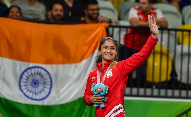 Gold medalist India's Vinesh Phogat waves during the medal ceremony of WFS50kg wrestling Nordic at the Commonwealth Games 2018 in Gold Coast. PTI Gold medalist India's Vinesh Phogat waves during the medal ceremony of WFS50kg wrestling Nordic at the Commonwealth Games 2018 in Gold Coast. PTI