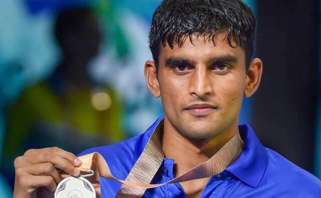 India's Manish Kaushik poses with his silver medal during the awards ceremony of the Men's Light 60kg boxing event at Commonwealth Games 2018. PTI India's Manish Kaushik poses with his silver medal during the awards ceremony of the Men's Light 60kg boxing event at Commonwealth Games 2018. PTI