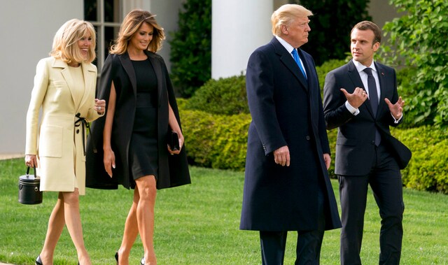 Trump and Macron, accompanied by their wives walk to a tree planting ceremony on the South Lawn of the White House in Washington. AP Trump and Macron, accompanied by their wives walk to a tree planting ceremony on the South Lawn of the White House in Washington. AP
