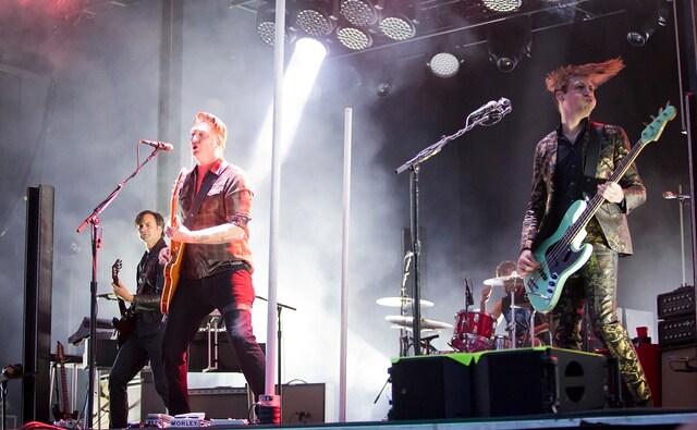 (From L-R) Troy Van Leeuwen, Josh Homme and Michael Shuman of Queens of the Stone Age perform at the Boston Calling Music Festival. Winslow Townson/Invision via AP (From L-R) Troy Van Leeuwen, Josh Homme and Michael Shuman of Queens of the Stone Age perform at the Boston Calling Music Festival. Winslow Townson/Invision via AP