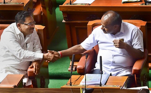 Kumaraswamy's motion seeking the confidence vote was declared passed by a voice vote by Speaker KR Ramesh Kumar in the absence of the BJP MLAs. Kumaraswamy greeted his deputy G Parameshwara after the floor test. PTI Kumaraswamy's motion seeking the confidence vote was declared passed by a voice vote by Speaker KR Ramesh Kumar in the absence of the BJP MLAs. Kumaraswamy greeted his deputy G Parameshwara after the floor test. PTI