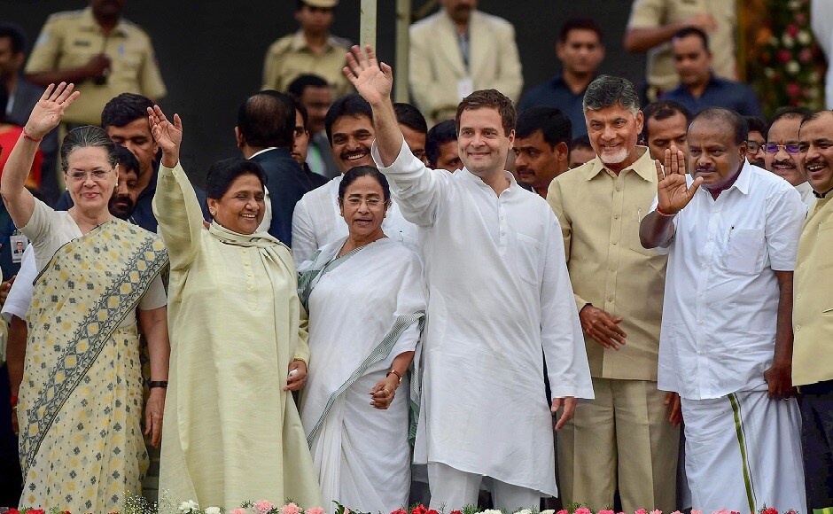 Kumaraswamy's swearing-in ceremony saw the unlikeliest of political bigwigs come together. Hugs and handshakes between the united Opposition had set the tone for the evening. PTI Kumaraswamy's swearing-in ceremony saw the unlikeliest of political bigwigs come together. Hugs and handshakes between the united Opposition had set the tone for the evening. PTI
