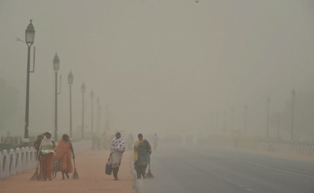 Women walk along Rajpath during a dust storm in New Delhi. The Met department has predicted another dust storm in parts of Rajasthan and UP in the next 48 hours. PTI Women walk along Rajpath during a dust storm in New Delhi. The Met department has predicted another dust storm in parts of Rajasthan and UP in the next 48 hours. PTI