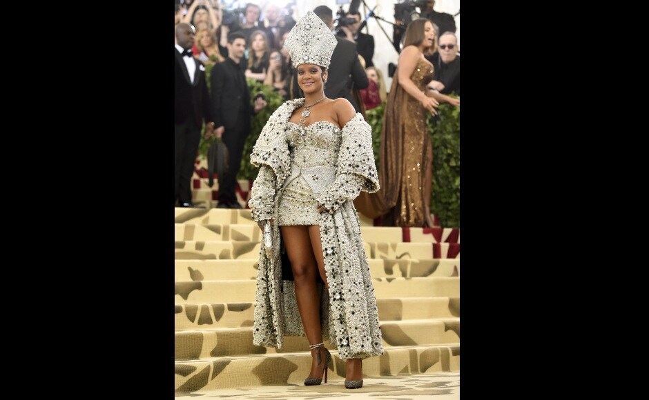Rihanna looked absolutely papal when she arrived in a Maison Margiela pearl- and crystal-embellished gown by John Galliano, complete with a matching papal mitre and necklace. Photo by Evan Agostini/Invision/AP Rihanna looked absolutely papal when she arrived in a Maison Margiela pearl- and crystal-embellished gown by John Galliano, complete with a matching papal mitre and necklace. Photo by Evan Agostini/Invision/AP