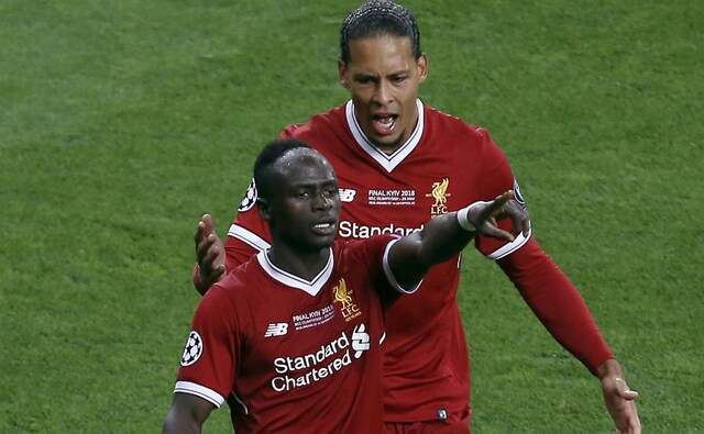 Liverpool's Sadio Mane, front, celebrates after scoring the equaliser. AP Liverpool's Sadio Mane, front, celebrates after scoring the equaliser. AP
