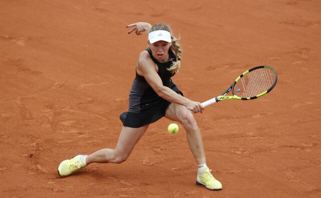 Danish ace Caroline Wozniacki returns a shot during her first-round match against Daniele Collins of the US. AP Danish ace Caroline Wozniacki returns a shot during her first-round match against Daniele Collins of the US. AP