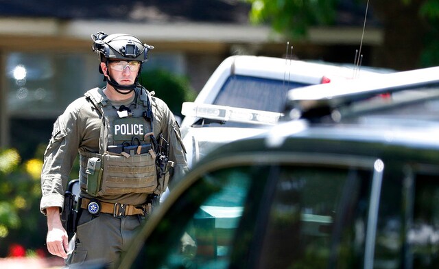 A state and federal law enforcement officer outside a home in Alvin, Texas, as part of the investigation in the aftermath of the high school shooting. AP A state and federal law enforcement officer outside a home in Alvin, Texas, as part of the investigation in the aftermath of the high school shooting. AP