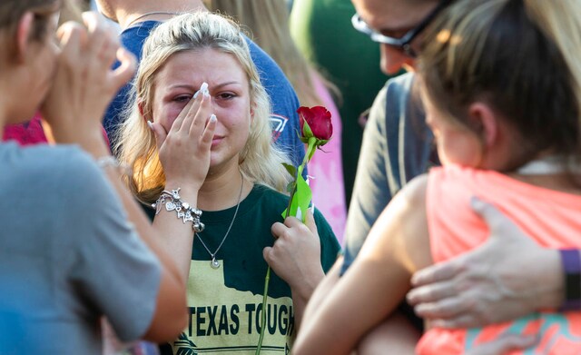 Students cry during a prayer vigil following the shooting at Santa Fe High School in Santa Fe, Texas, on Friday, 18 May 2018. AP Students cry during a prayer vigil following the shooting at Santa Fe High School in Santa Fe, Texas, on Friday, 18 May 2018. AP
