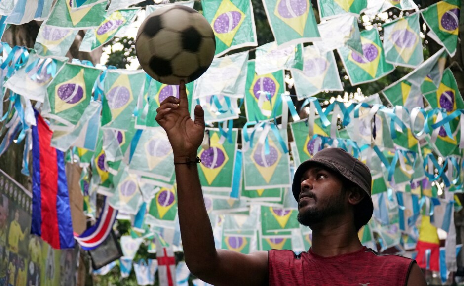 Just how did Kolkata come to be so football crazy? It may have something to do with the sport's history in the City of Joy. Here: A Portugal supporter spins a ball on his finger. Just how did Kolkata come to be so football crazy? It may have something to do with the sport's history in the City of Joy. Here: A Portugal supporter spins a ball on his finger.