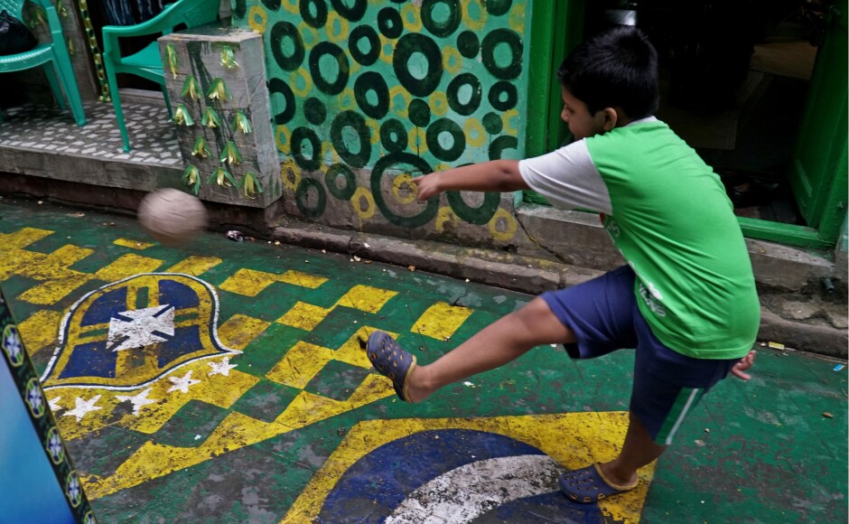 The East Bengal-Mohun Bagan legacy is well known throughout India. Growing up, Bengali children fight over the superiority of chingri (prawn) and ilish (Hilsa) — or their favourite club. Bengali households will wear an air of gloom when a derby match is lost against the rival club. Here: A young fan polishes his footie skills. The East Bengal-Mohun Bagan legacy is well known throughout India. Growing up, Bengali children fight over the superiority of chingri (prawn) and ilish (Hilsa) — or their favourite club. Bengali households will wear an air of gloom when a derby match is lost against the rival club. Here: A young fan polishes his footie skills.