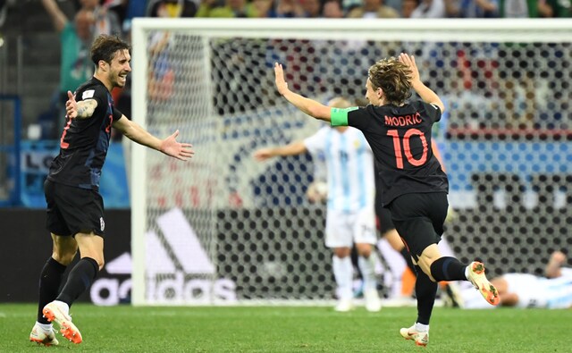 Croatian midfielder Luka Modric celebrates with defender Sime Vrsaljko after scoring the third goal of a 3-0 victory over Argentina. AFP Croatian midfielder Luka Modric celebrates with defender Sime Vrsaljko after scoring the third goal of a 3-0 victory over Argentina. AFP