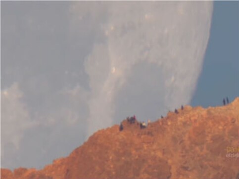 Watch: Video shot through telescopic lens makes it seem like the moon is falling from the sky Watch: Video shot through telescopic lens makes it seem like the moon is falling from the sky