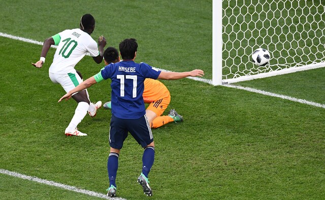 Senegal attacker Sadio Mane opened the scoring in a match that ended 2-2, with both teams finishing the night level on points at the top of the table. AFP Senegal attacker Sadio Mane opened the scoring in a match that ended 2-2, with both teams finishing the night level on points at the top of the table. AFP