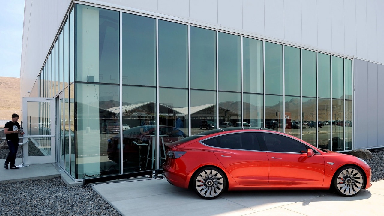 A prototype of the Tesla Model 3 is on display in front of the Tesla Gigafactory that produces it. Reuters
