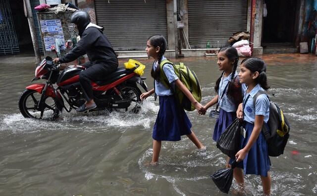 The state government's disaster management department sounded an alert to all the districts, an official at the secretariat said. School students wade through water in northern part of the city on Tuesday. PTI The state government's disaster management department sounded an alert to all the districts, an official at the secretariat said. School students wade through water in northern part of the city on Tuesday. PTI