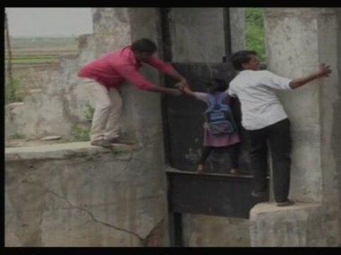 Residents of two Gujarat villages put lives at risk daily, indulge in acrobatics to make way across broken 9-foot-high bridge Residents of two Gujarat villages put lives at risk daily, indulge in acrobatics to make way across broken 9-foot-high bridge