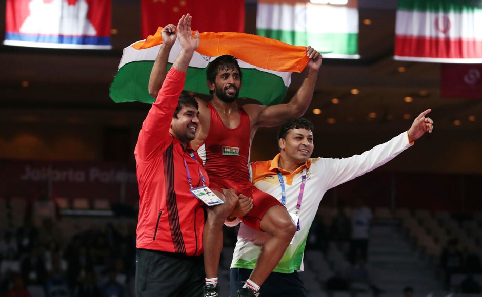 India's Bajrang Punia reacts after winning the Wrestling Men's Freestyle 65 kg final against Japan's Daichi Takatani. AFP India's Bajrang Punia reacts after winning the Wrestling Men's Freestyle 65 kg final against Japan's Daichi Takatani. AFP