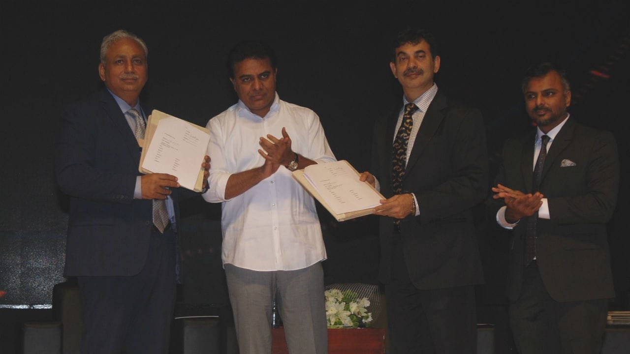 CP Gurnani, CEO & MD of Tech Mahindra (left); IT Minister KT Rama Rao (center) and Jayesh Ranjan (right) exchange the MoU.