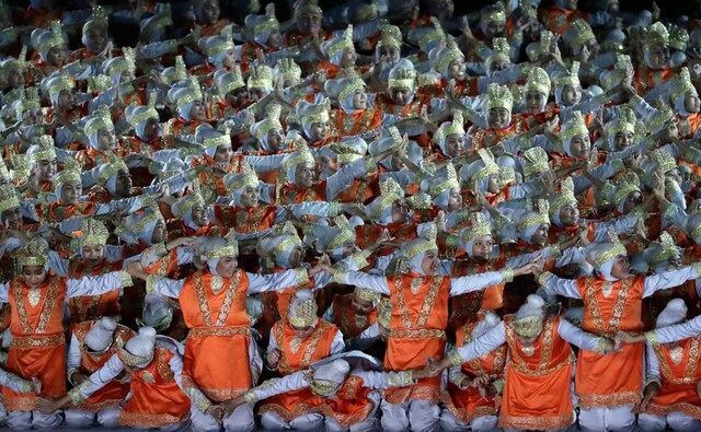 Dancers perform the traditional Indonesian dance form called Saman. AP Dancers perform the traditional Indonesian dance form called Saman. AP