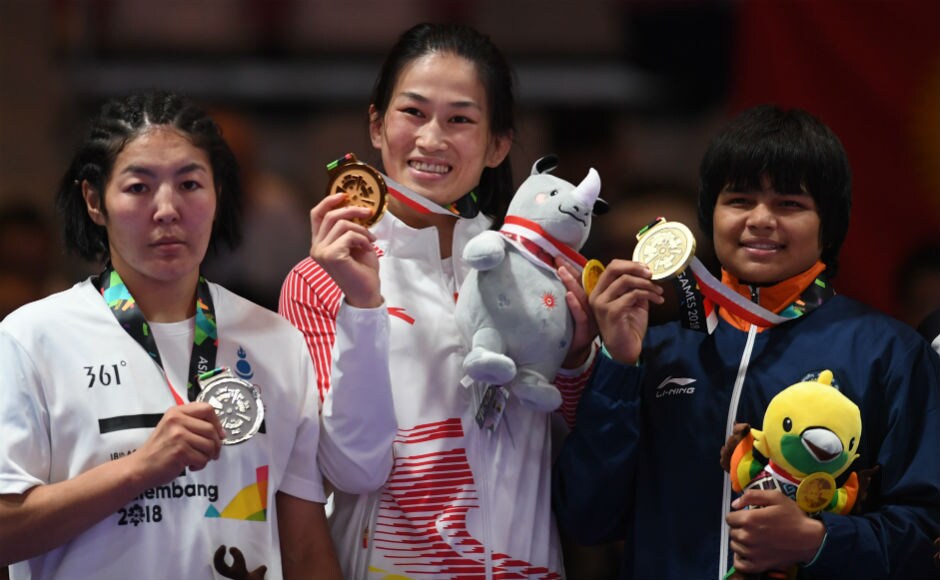 Divya Kakran, who became the third Indian wrestler to win a medal at the ongoing games, displays her bronze medal in the women's Freestyle 68kg event. AFP Divya Kakran, who became the third Indian wrestler to win a medal at the ongoing games, displays her bronze medal in the women's Freestyle 68kg event. AFP