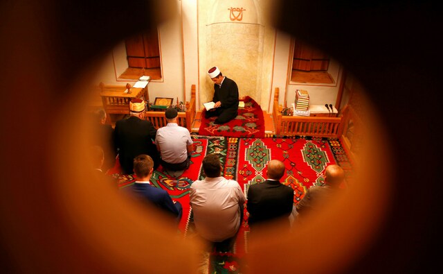 Bosnian Muslims in prayer during the Muslim festival of Eid al-Adha at a mosque in Kraljeva Sutjeska near Kakanj in Bosnia and Herzegovina on 21 August, 2018. Reuters/Dado Ruvic Bosnian Muslims in prayer during the Muslim festival of Eid al-Adha at a mosque in Kraljeva Sutjeska near Kakanj in Bosnia and Herzegovina on 21 August, 2018. Reuters/Dado Ruvic