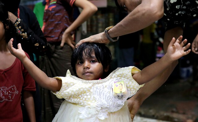 A Rohingya refugee girl tries on a new dress at a shop to celebrate Eid in the Kutupaloong refugee camp in Bangladesh's Cox's Bazar. Eid al-Adha, also known as the 'Festival of Sacrifice', falls on the tenth day of Dhu al-Hijjah and is celebrated with great enthusiasm by Muslims the world over. Reuters/ Mohammad Ponir Hossain A Rohingya refugee girl tries on a new dress at a shop to celebrate Eid in the Kutupaloong refugee camp in Bangladesh's Cox's Bazar. Eid al-Adha, also known as the 'Festival of Sacrifice', falls on the tenth day of Dhu al-Hijjah and is celebrated with great enthusiasm by Muslims the world over. Reuters/ Mohammad Ponir Hossain
