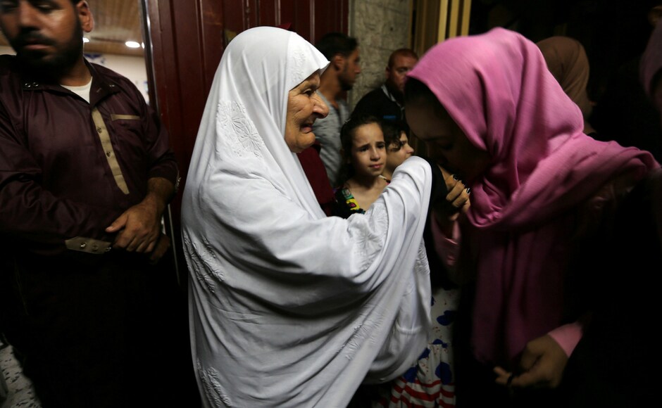 A Palestinian girl kisses the hand of her grandmother who leaves Gaza for the annual Haj pilgrimage in Mecca, in the southern Gaza Strip on 3 August, 2018. Nearly 2 million Muslims, including 1.68 million from abroad, flood Mecca's narrow streets for the annual rite which started on Sunday, 19 August, 2018. Reuters/ Ibraheem Abu Mustafa A Palestinian girl kisses the hand of her grandmother who leaves Gaza for the annual Haj pilgrimage in Mecca, in the southern Gaza Strip on 3 August, 2018. Nearly 2 million Muslims, including 1.68 million from abroad, flood Mecca's narrow streets for the annual rite which started on Sunday, 19 August, 2018. Reuters/ Ibraheem Abu Mustafa