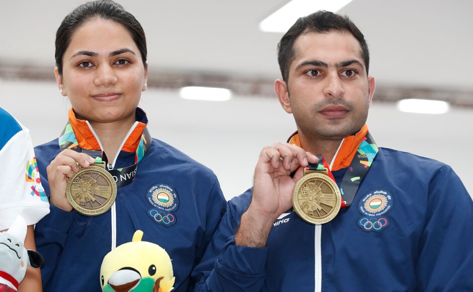 India's Apurvi Chandela, left, and Ravi Kumar celebrate with their bronze medal during awards ceremony for the 10m Air Rifle Mixed Team Final shooting event. AP India's Apurvi Chandela, left, and Ravi Kumar celebrate with their bronze medal during awards ceremony for the 10m Air Rifle Mixed Team Final shooting event. AP
