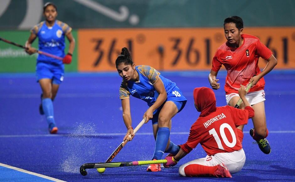 India's Udita plays the ball past Indonesia players during India's 8-0 win over Indonesia in the women's hockey pool B match. AFP India's Udita plays the ball past Indonesia players during India's 8-0 win over Indonesia in the women's hockey pool B match. AFP